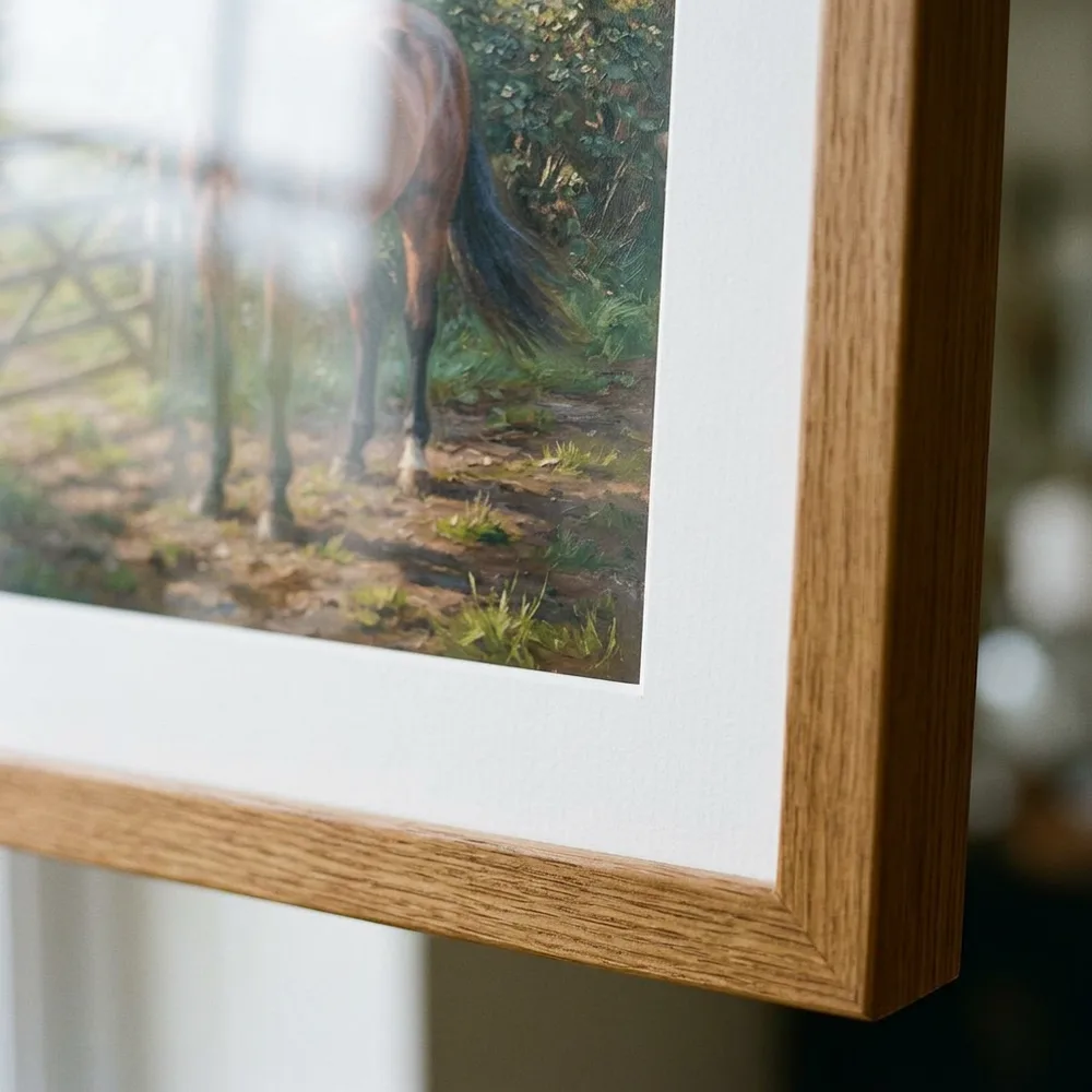Mitred corner of a natural oak frame with white mount